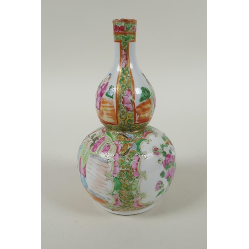 149 - A C19th Chinese Canton famille rose porcelain double gourd vase, with decorative panels depicting fi... 