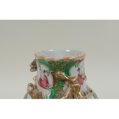 150 - A C19th Chinese Canton famille rose porcelain vase, with two gilt raised dragons and decorative pane... 