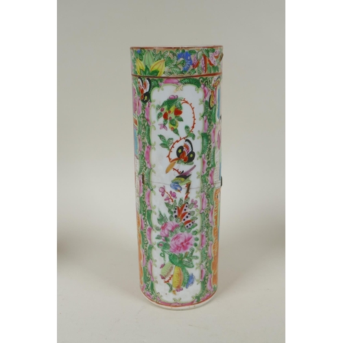 152 - A C19th Chinese Canton famille rose cylinder vase and two smaller, all with decorative panels depict... 