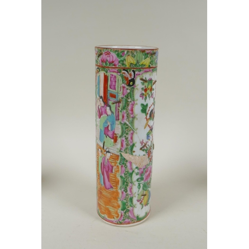 152 - A C19th Chinese Canton famille rose cylinder vase and two smaller, all with decorative panels depict... 