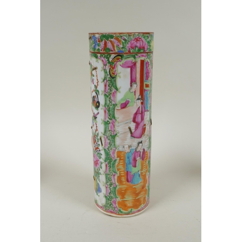 152 - A C19th Chinese Canton famille rose cylinder vase and two smaller, all with decorative panels depict... 