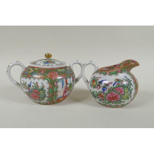 153 - A Chinese Republic Canton famille rose porcelain sugar pot, jug and two tea cups, largest 12cm diame... 