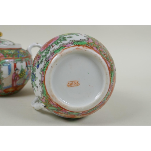 153 - A Chinese Republic Canton famille rose porcelain sugar pot, jug and two tea cups, largest 12cm diame... 