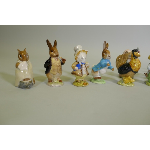 16 - A collection of vintage Beswick Beatrix Potter figurines, gold and brown back stamps including Foxy ... 