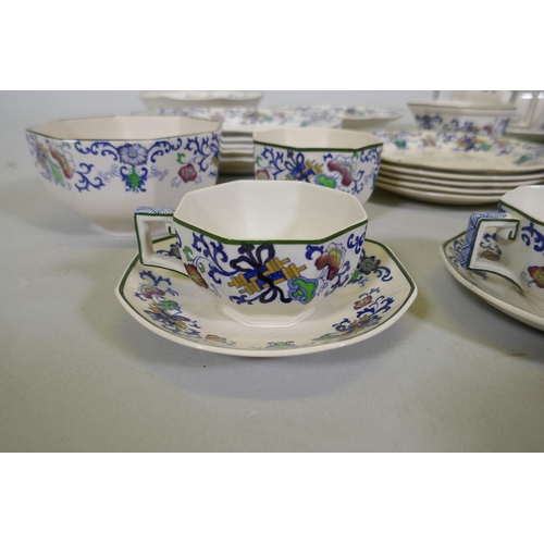 161 - A Doulton Burslem Nankin part dinner and tea service with various sized plates, saucers serving bowl... 