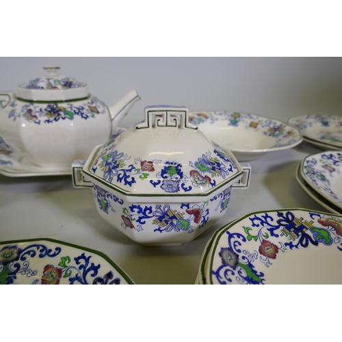 161 - A Doulton Burslem Nankin part dinner and tea service with various sized plates, saucers serving bowl... 