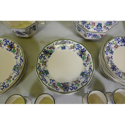 161 - A Doulton Burslem Nankin part dinner and tea service with various sized plates, saucers serving bowl... 