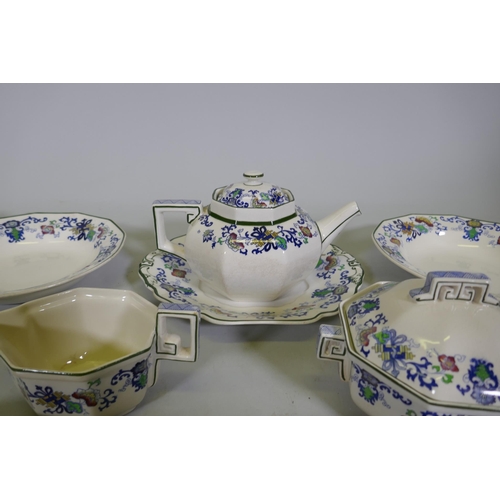 161 - A Doulton Burslem Nankin part dinner and tea service with various sized plates, saucers serving bowl... 