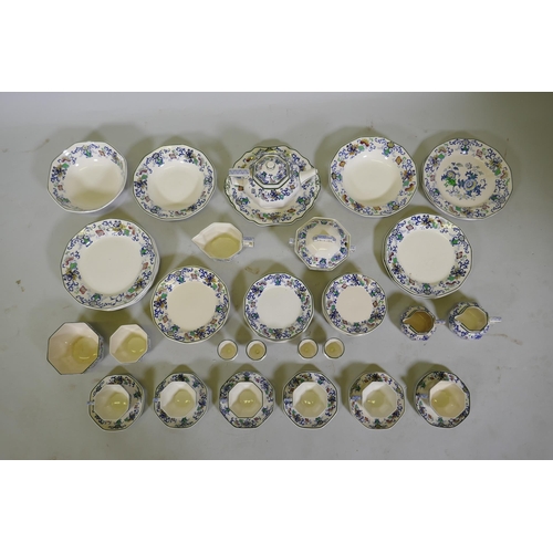 161 - A Doulton Burslem Nankin part dinner and tea service with various sized plates, saucers serving bowl... 