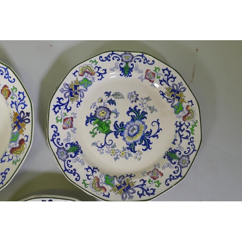 161 - A Doulton Burslem Nankin part dinner and tea service with various sized plates, saucers serving bowl... 