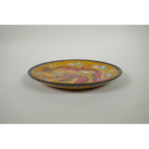 178 - A Chinese cloisonne dish decorated with a red dragon and flaming pearl, 20cm diameter