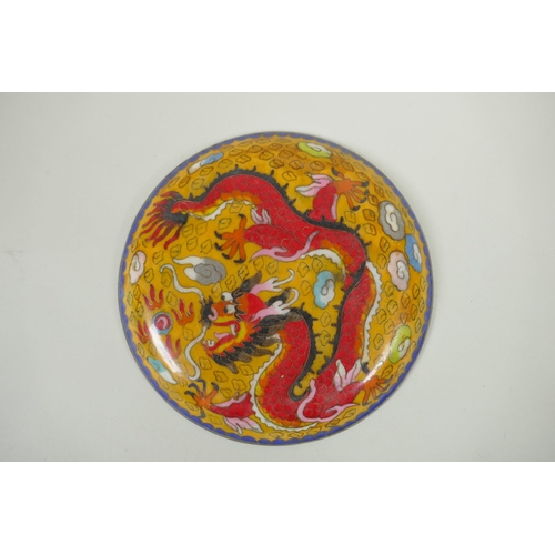 178 - A Chinese cloisonne dish decorated with a red dragon and flaming pearl, 20cm diameter