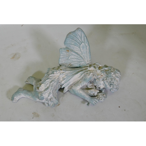 181 - A cast iron garden figure of a sleeping fairy, 42cm long