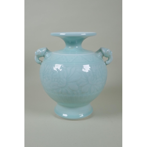 183 - A Chinese celadon glazed porcelain vase with two elephant mask handles and underglaze floral decorat... 