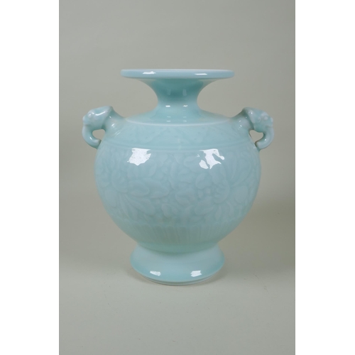 183 - A Chinese celadon glazed porcelain vase with two elephant mask handles and underglaze floral decorat... 