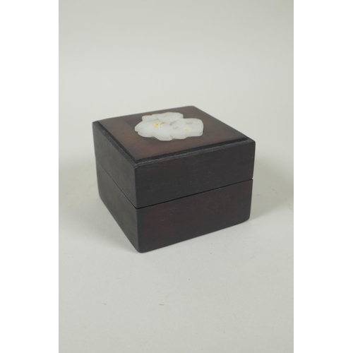 185 - A Chinese hardwood box, the cover inset with carved and pierced celadon jade 'Fu' character, 9 x 9cm