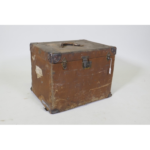 189 - A vintage canvas travel trunk with leather mounts, 52 x 42cm, 40cm high