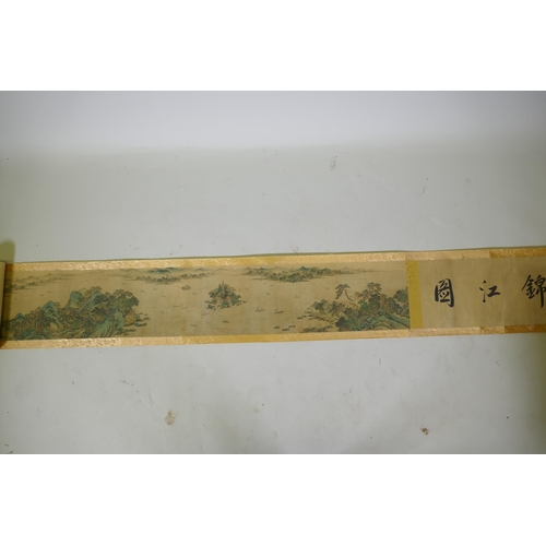 193 - A Chinese printed watercolour scroll depicting an extensive riverside landscape, 29cm high