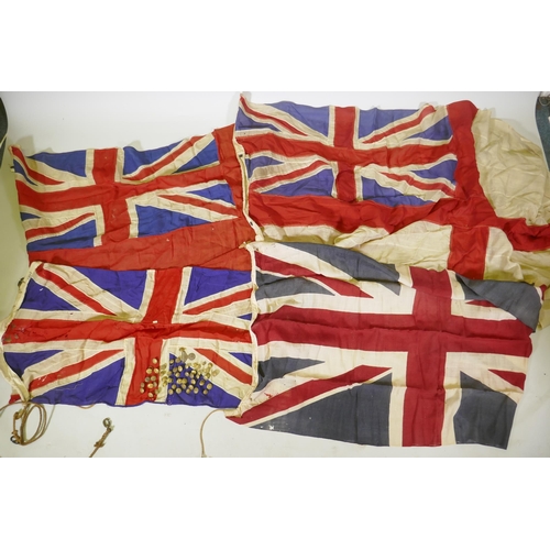 194 - Four vintage British Naval flags to include two Union Jacks, a white St George's cross ensign and a ... 