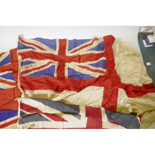 194 - Four vintage British Naval flags to include two Union Jacks, a white St George's cross ensign and a ... 