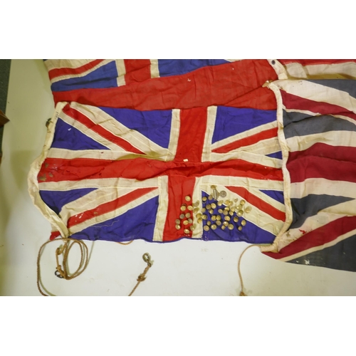 194 - Four vintage British Naval flags to include two Union Jacks, a white St George's cross ensign and a ... 