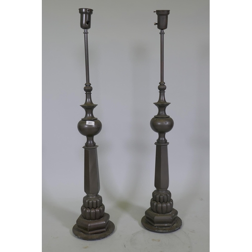 201 - A pair of vintage metal lamps, 110cm high