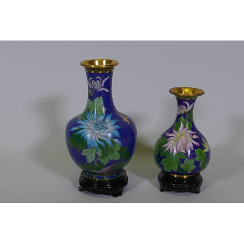 202 - Two Chinese cloisonne vases, floral decoration on a blue ground, with wood stands, late C20th, large... 