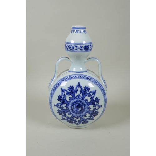 206 - A Chinese blue and white porcelain garlic head shaped flask with two handles and yin yang decoration... 