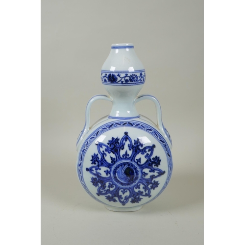 206 - A Chinese blue and white porcelain garlic head shaped flask with two handles and yin yang decoration... 