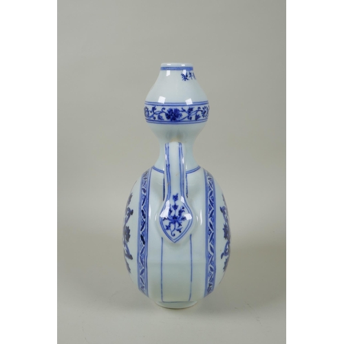 206 - A Chinese blue and white porcelain garlic head shaped flask with two handles and yin yang decoration... 