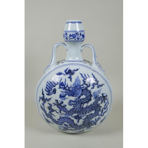 208 - A Chinese blue and white porcelain two handled moon flask decorated with a dragon and flaming pearl,... 