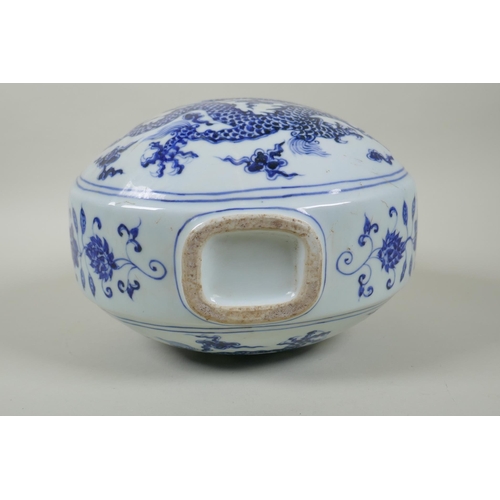 208 - A Chinese blue and white porcelain two handled moon flask decorated with a dragon and flaming pearl,... 