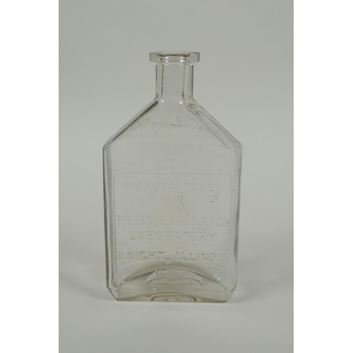 21 - An antique American apothecary bottle, by Leslie E. Keeley (L.E.K.), 15cm high