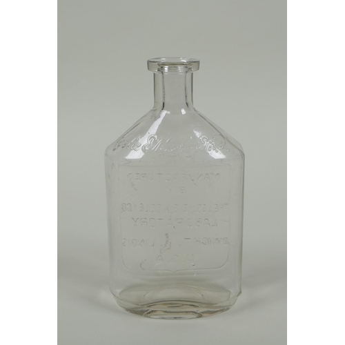 21 - An antique American apothecary bottle, by Leslie E. Keeley (L.E.K.), 15cm high