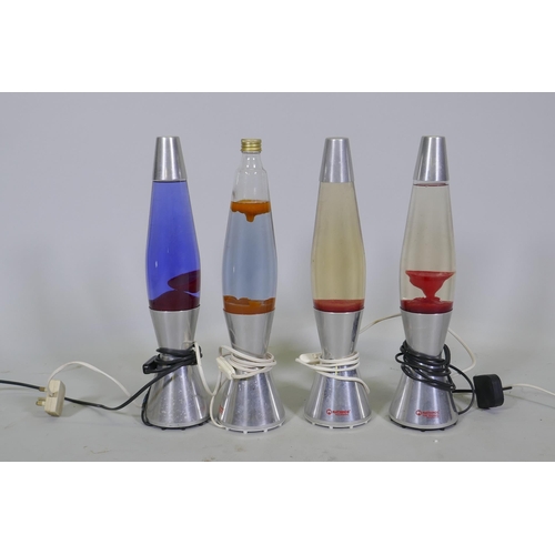 219 - Four Mathmos Astro baby lava lamps, one lacking top, 43cm high