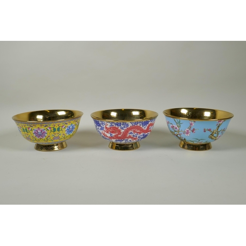 238 - Three Chinese polychrome porcelain bowls with gilt lustre interiors, decorated with flowers, peaches... 