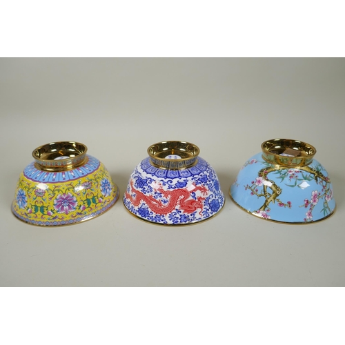 238 - Three Chinese polychrome porcelain bowls with gilt lustre interiors, decorated with flowers, peaches... 