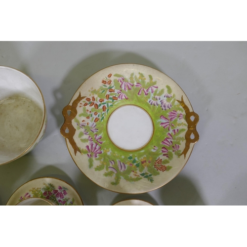 241 - An antique Staffordshire part tea service decorated with foxgloves of various colours, largest 24cm ... 