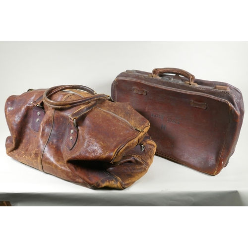 244 - A vintage leather holdall, together with a smaller suitase