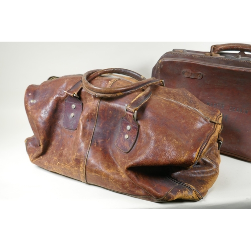 244 - A vintage leather holdall, together with a smaller suitase