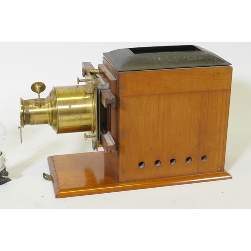 25 - A Victorian Eclipse magic lantern, by R.R. Beard, mahogany cased with brass fittings, and a Quickset... 