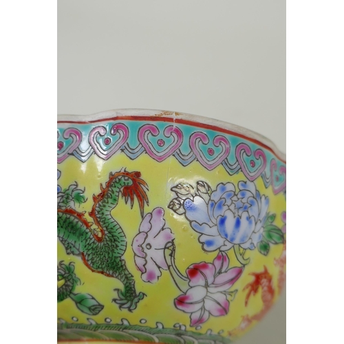 253 - A Chinese famille jaune eggshell porcelain rice bowl decorated with polychrome dragons, TongZhi seal... 