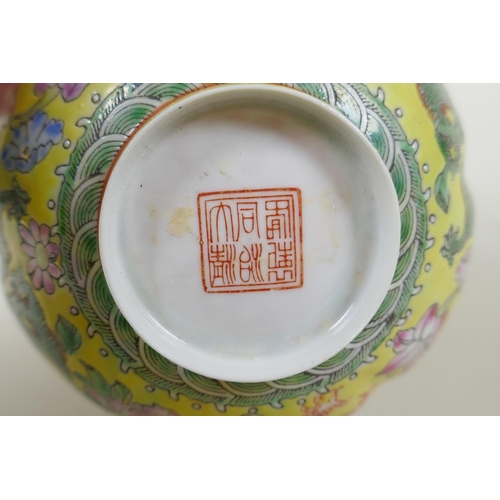 253 - A Chinese famille jaune eggshell porcelain rice bowl decorated with polychrome dragons, TongZhi seal... 