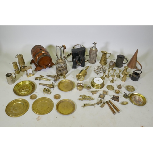 261 - A large collection of vintage brass, bronze, copper and other metalwares, including trays, candlesti... 