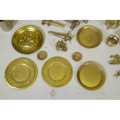 261 - A large collection of vintage brass, bronze, copper and other metalwares, including trays, candlesti... 