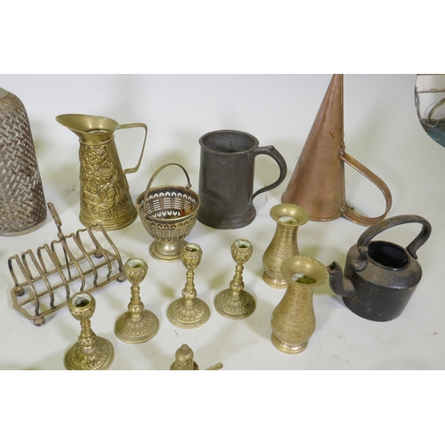 261 - A large collection of vintage brass, bronze, copper and other metalwares, including trays, candlesti... 