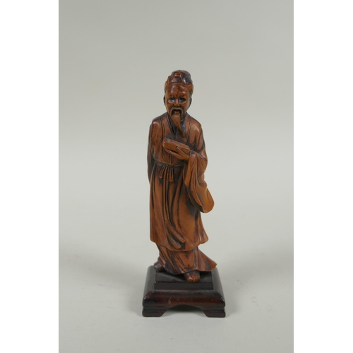 263 - A Chinese carved boxwood figure of a bearded sage, 15cm high