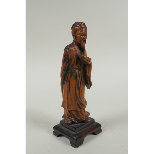 263 - A Chinese carved boxwood figure of a bearded sage, 15cm high