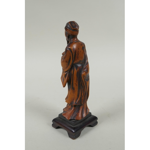 263 - A Chinese carved boxwood figure of a bearded sage, 15cm high