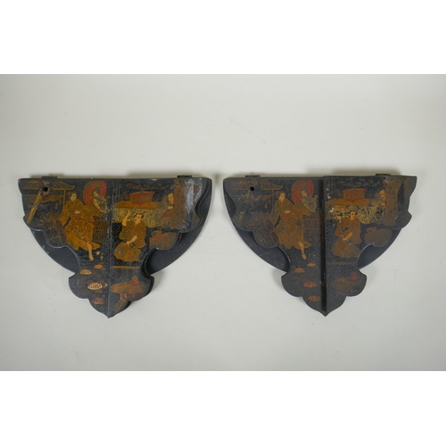 277 - A pair of Japanese export Japanned papier mache folding brackets, decorated with geisha and their pa... 